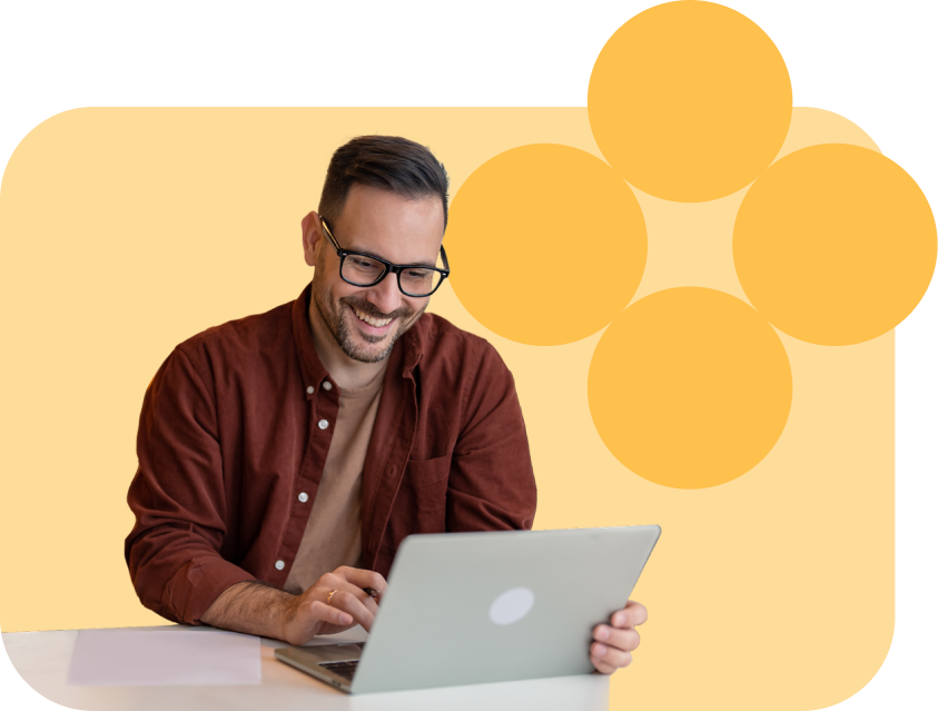 man smiling using computer