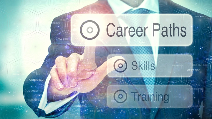 man in suit with finger hovering over floating career path icon