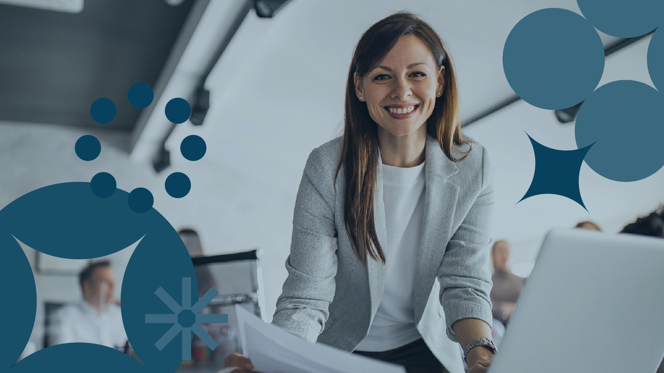 Female project manager working on business analysis on laptop with floating graphics