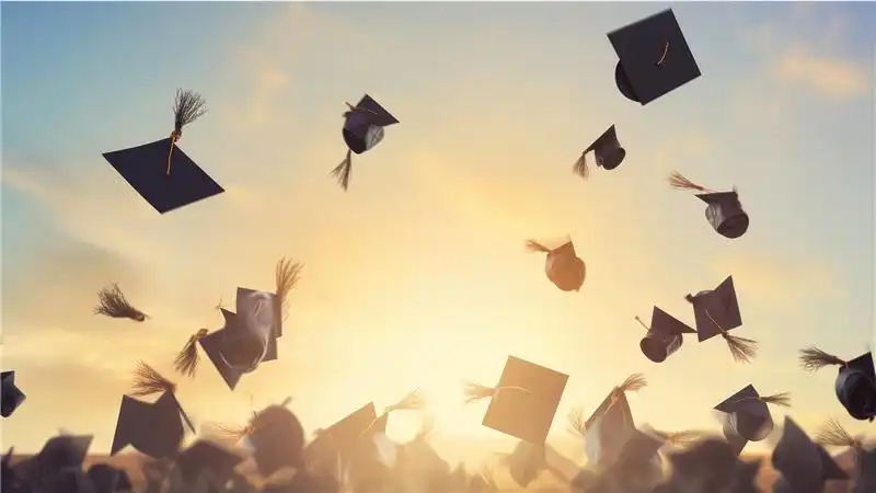 graduation caps flying in the air