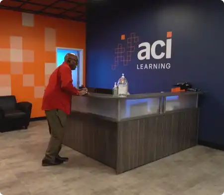 reception desk at physical location with man waiting for help